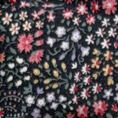 Floral patterned fabric with colorful flowers on a black background