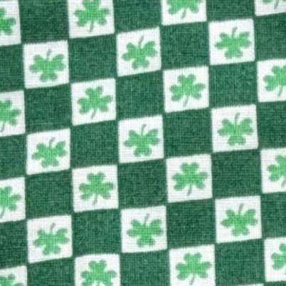 Green and white checkered pattern with shamrock symbols